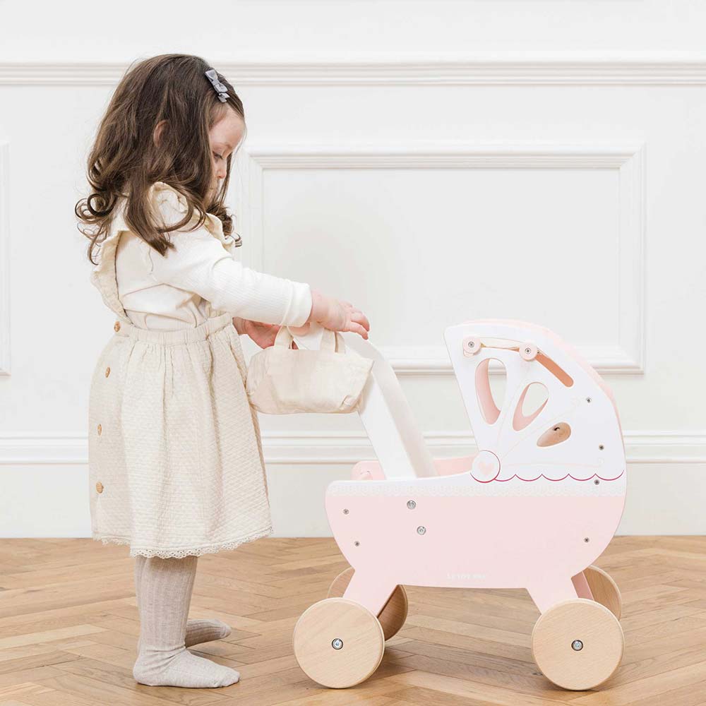 TV322-sweet-dreams-pram-child-placing-baby-bag-ont-handle.jpg